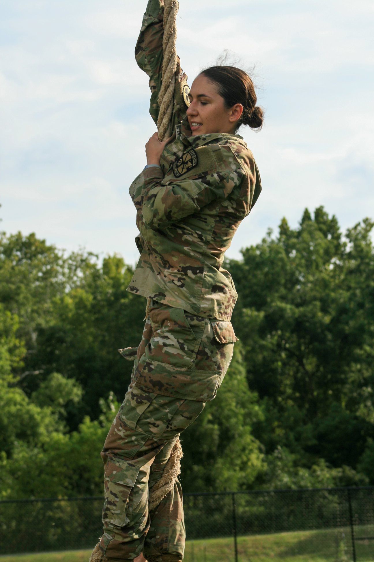 Kylie Schatmeyer climbing the rope at the end of the obstacle course at Venture Out. (August, 2019)